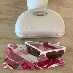 Pink and white Oakley glasses